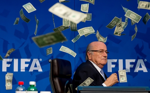 PHOTO from FIFA Office Headquarters as Comedian Simon Brodkin throws cash at FIFA President S. Blatter